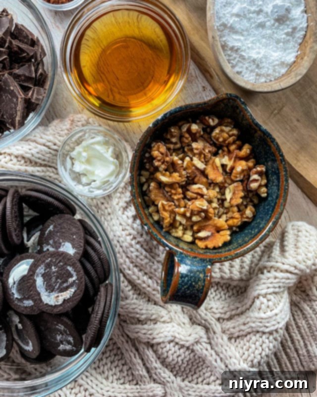 Decadent Bittersweet Chocolate Bourbon Balls 11 A large platter filled with a variety of Chocolate Bourbon Balls, some with chocolate coating, others with powdered sugar, for a festive display.