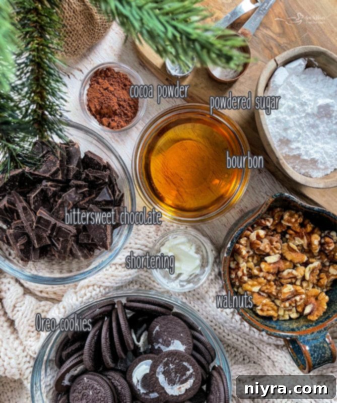 Decadent Bittersweet Chocolate Bourbon Balls 4 A flat lay photograph showcasing all the simple ingredients required for making Chocolate Bourbon Balls, including walnuts, Oreos, chocolate, and bourbon.