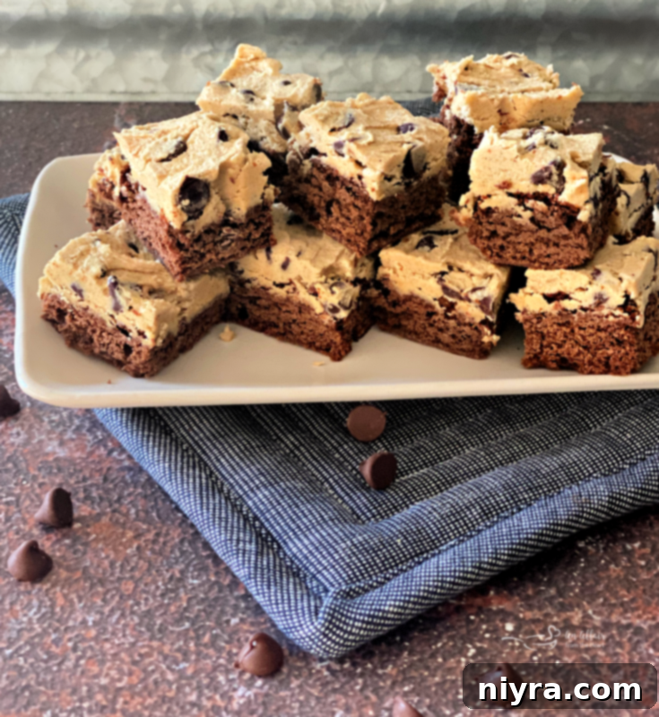 Cookie Dough Brownie Dream 15 Close-up of a perfectly cut chocolate chip cookie dough brownie, showing distinct layers