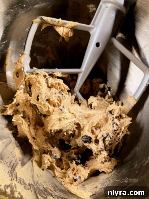 Cookie Dough Brownie Dream 4 Ingredients for chocolate chip cookie dough brownies laid out on a wooden board