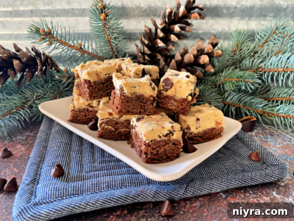 Cookie Dough Brownie Dream 7 Close-up of chocolate chip cookie dough brownie bars arranged on a white surface