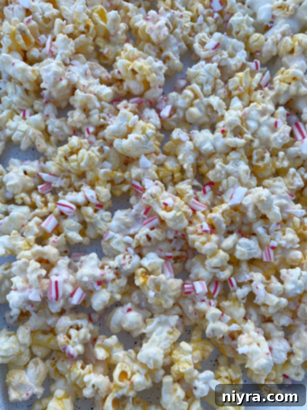 Pin graphic for Peppermint Candy Coated Popcorn.