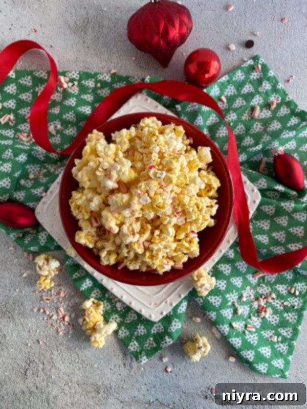 Another close-up of Peppermint Bark Popcorn in a festive bowl.