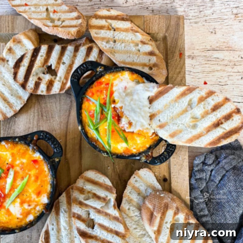 Slow Cooker Crab Dip in an artistic overhead shot, showing its creamy texture and fresh garnishes.