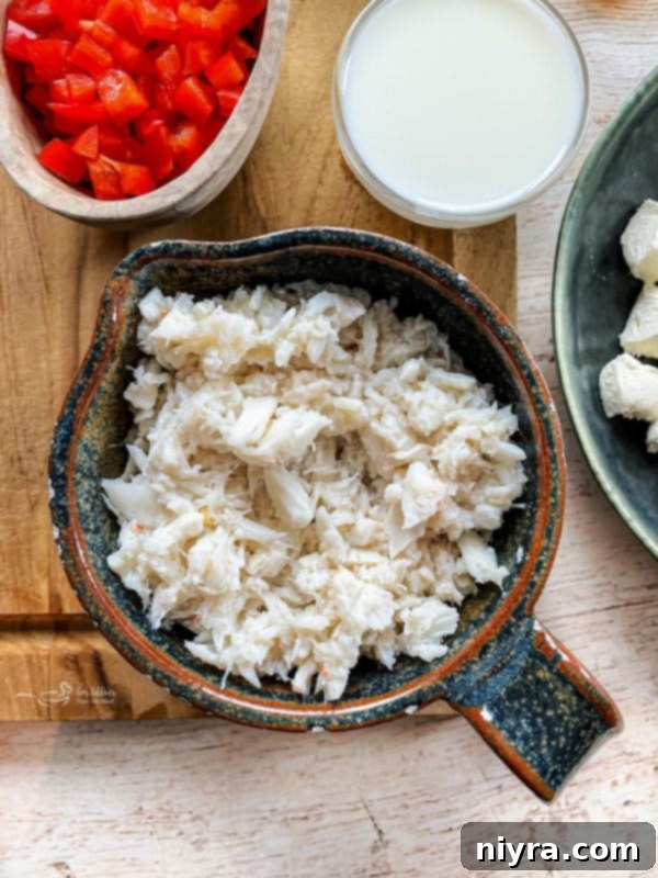 Overhead shot of Slow Cooker Crab Dip with toasted bread, ready to be served.