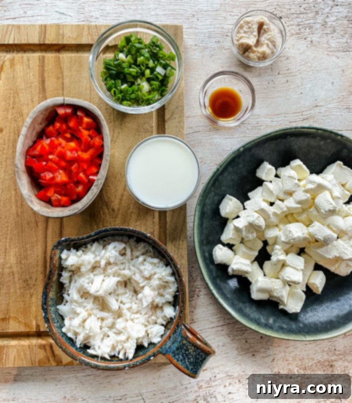 Slow Cooker Crab Dip being stirred in a crockpot, showing its creamy texture.