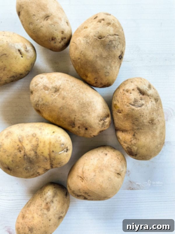 Perfectly Crispy Homemade French Fries 6 Eight potatoes, ready for preparation to be turned into delicious homemade fries