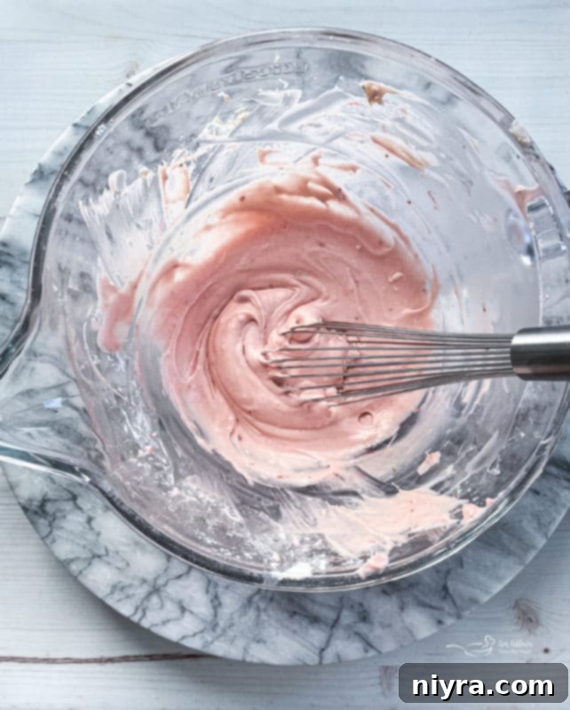 Prepared Strawberry Cream Cheese Filling in a bowl, ready to be piped