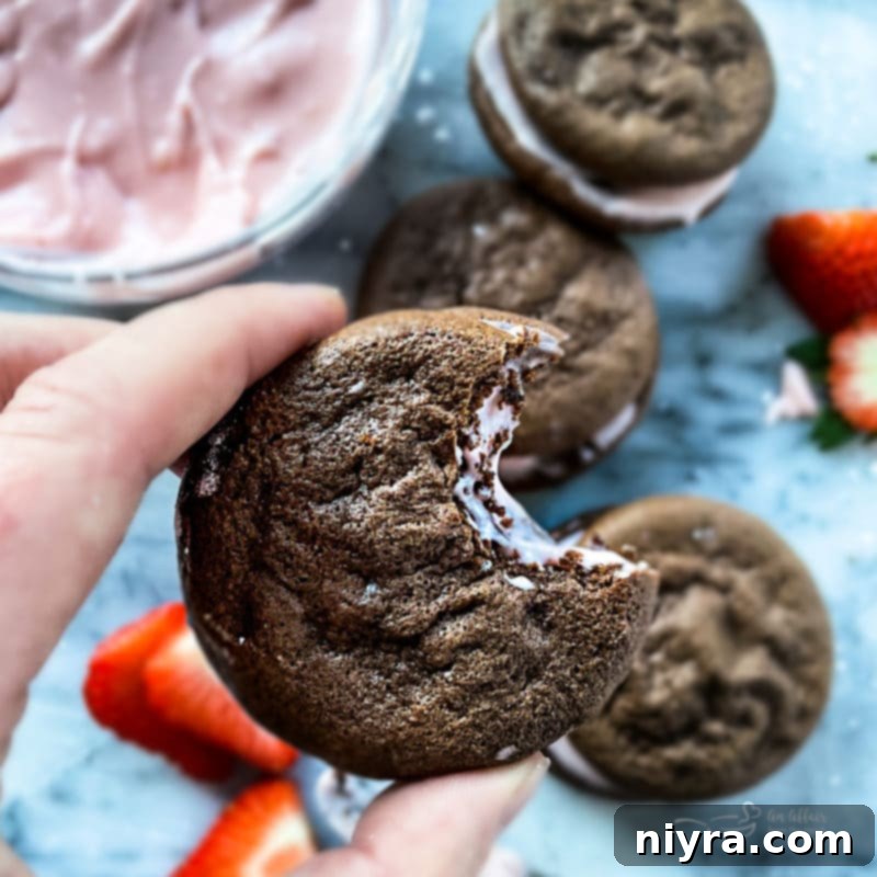 Close-up of a delectable Chocolate Strawberry Whoopie Pie, showing the fluffy cake and creamy filling
