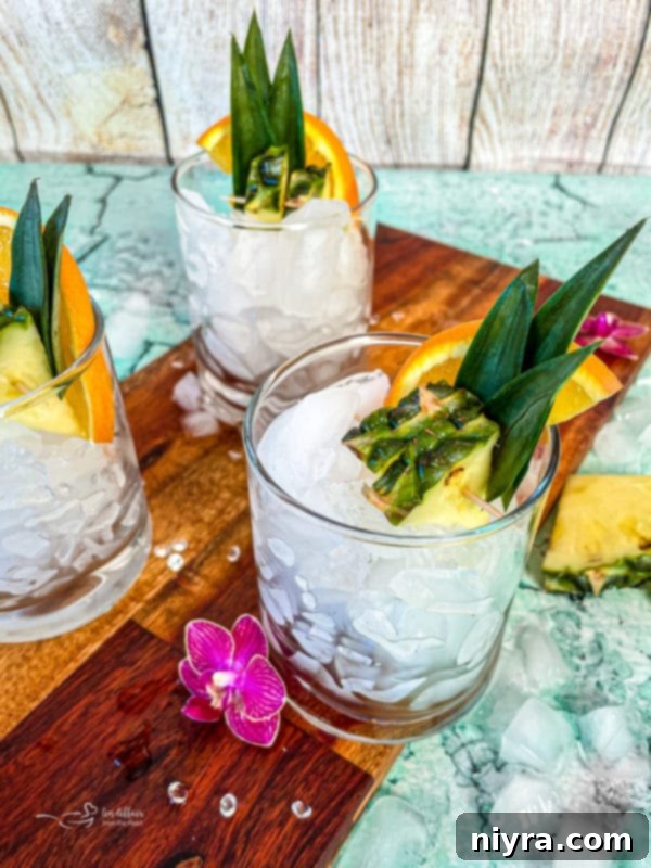 A glass being filled with ice, preparing for the cocktail mixture