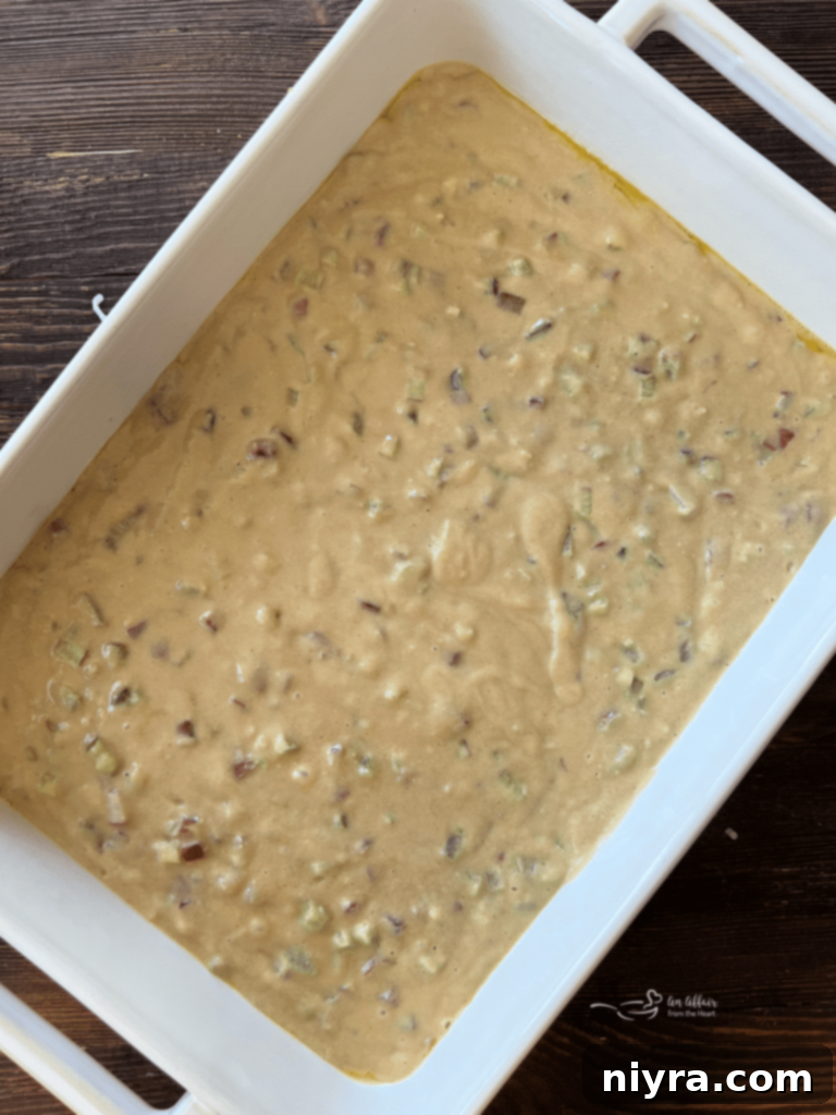 Sweet and Tart Rhubarb Bliss 11 Chopped rhubarb being folded into cake batter.