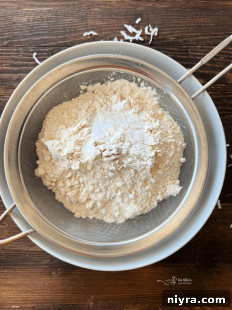 Sweet and Tart Rhubarb Bliss 9 Sugar, butter, and eggs being creamed together in a bowl with an electric mixer.