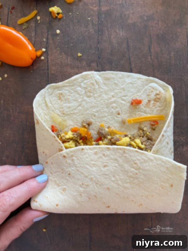 The sides of the tortilla are folded over the filling.