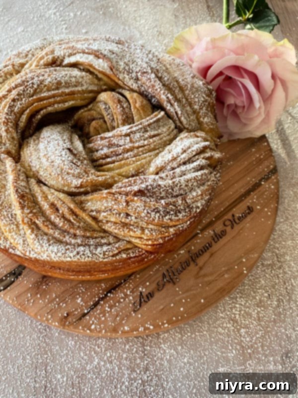 Bloomed Russian Delight 17 A beautifully presented Russian Rose Bread on a rustic cutting board, ready to be sliced.