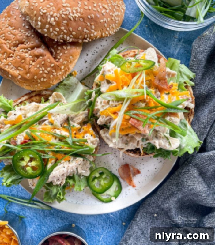 Crack chicken made in the pressure cooker on buns with green onions and jalapenos 