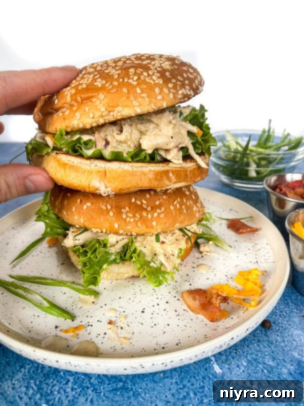 Two stacked sandwiches with Instant Pot crack chicken in the center with lettuce