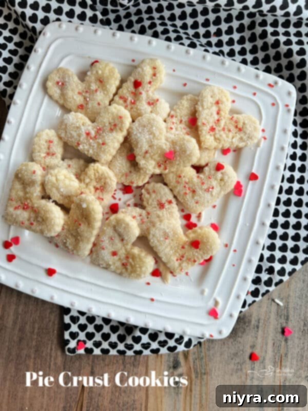 A collection of various shaped Pie Crust Cookies, perfect for a gathering.