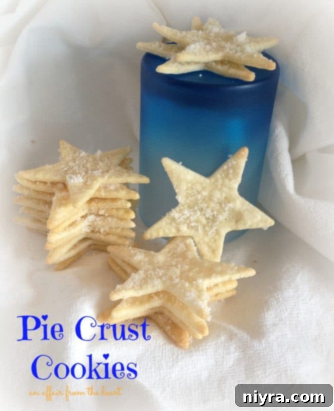 Star-shaped pie crust cookies artfully arranged on a white cloth, with text "pie crust cookies" nearby.
