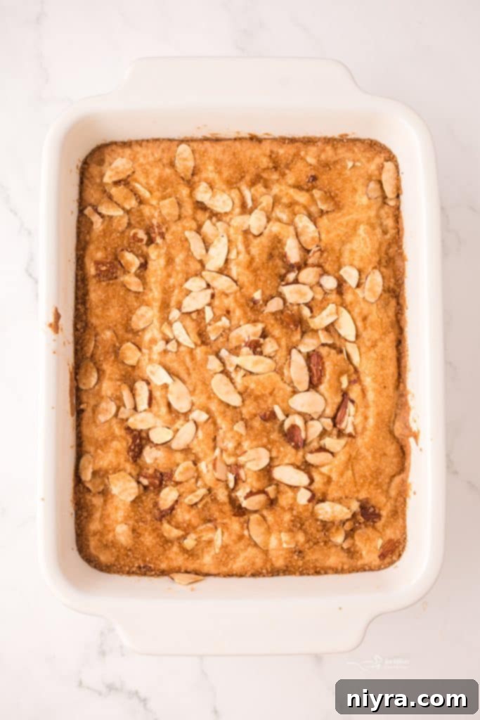 Dutch Almond Letter Bars 9 A freshly prepared pan of Dutch Letter Bars, topped with slivered almonds, ready to be baked to golden perfection.