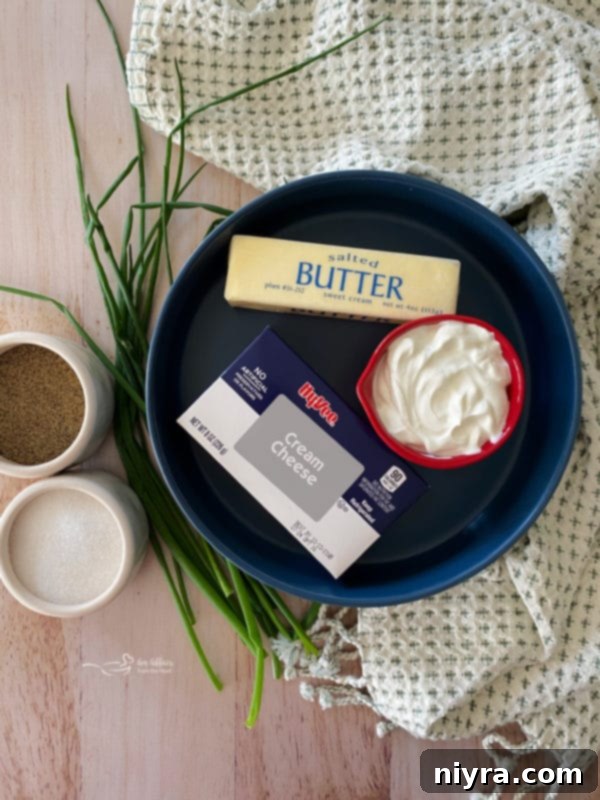 Ingredients for slow cooker mashed potatoes: butter, salt, pepper, and cream cheese.