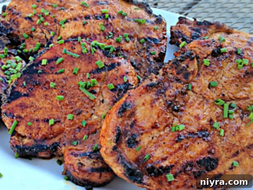 Succulent Apple Moonshine Glazed Pork Chops 3 Grilled pork chops with a beautiful glaze, fresh off the grill