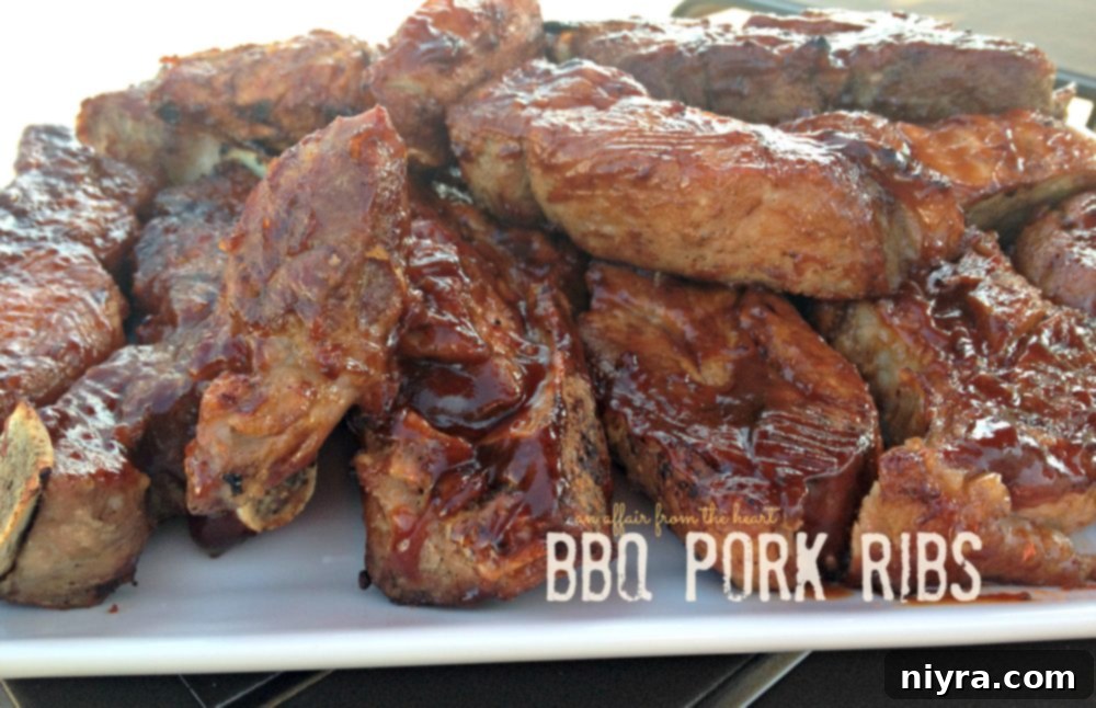 Succulent Apple Moonshine Glazed Pork Chops 8 Hearty BBQ Pork Ribs, generously coated in sauce