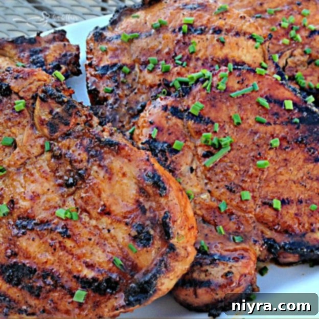 Succulent Apple Moonshine Glazed Pork Chops 9 Close-up of perfectly grilled Apple Moonshine Glazed Pork Chops