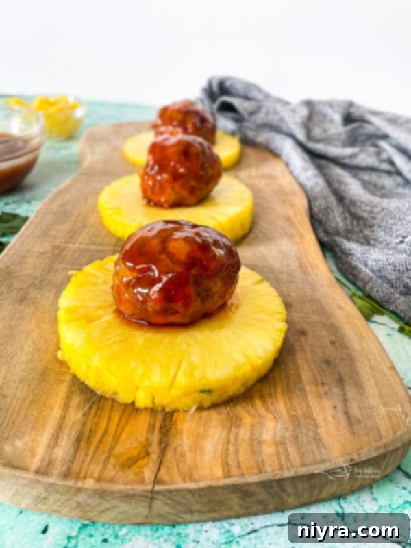 Hawaiian ham balls on top of pineapple slices
