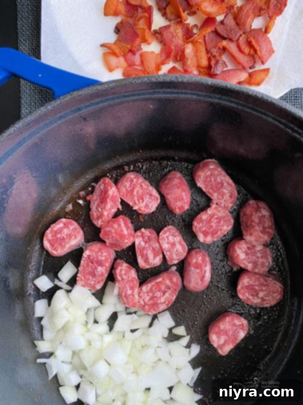 Bowl of uncooked Meat Lovers Baked Beans ingredients mixed together, ready for the stove