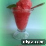 Close-up of Watermelon Sorbet served in a sundae glass with a spoon