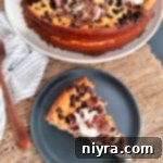 Irish Cream Cheesecake whole and sliced piece on plate