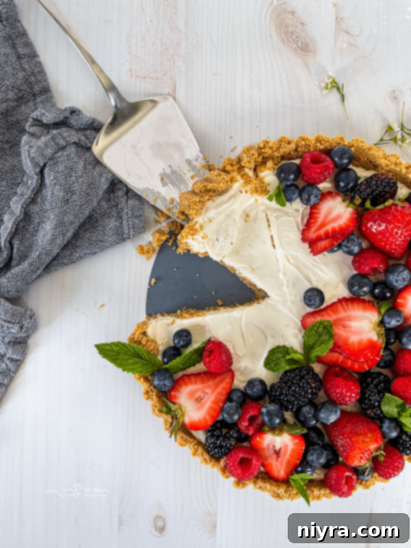 Effortless & Elegant No-Bake Fruit Tart 2 top view of one no bake fruit tart with fresh berries and mint