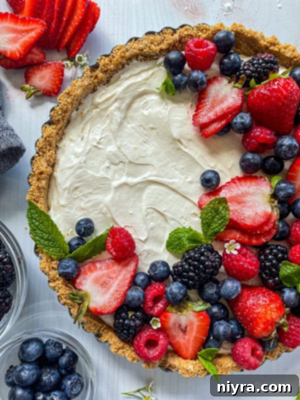 Effortless & Elegant No-Bake Fruit Tart 3 Top view of no bake fruit tart with fresh blueberries, strawberries, blackberries, and raspberries