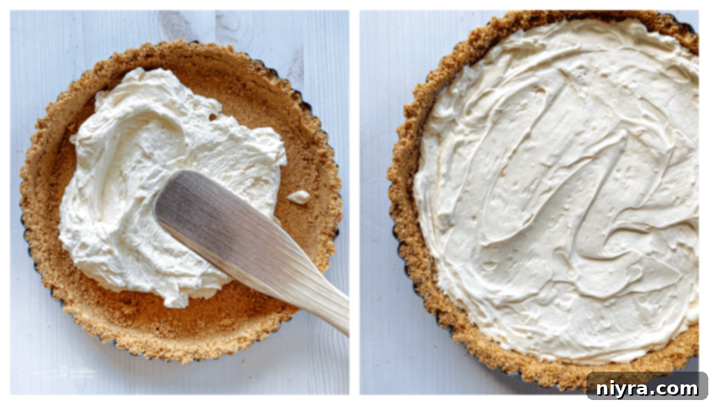 Effortless & Elegant No-Bake Fruit Tart 8 cream cheese mixture being spread on graham cracker crumbs