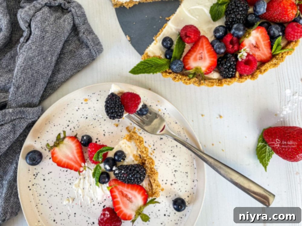 Effortless & Elegant No-Bake Fruit Tart 10 one plate with a slice of no bake fruit tart with fresh berries