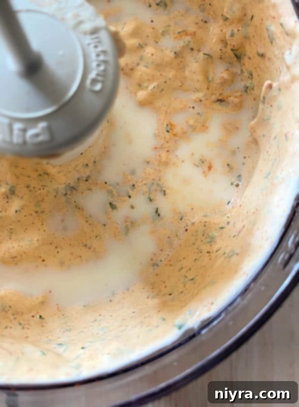 Southwest Steakhouse Salad 7 milk being poured into homemade chipotle ranch