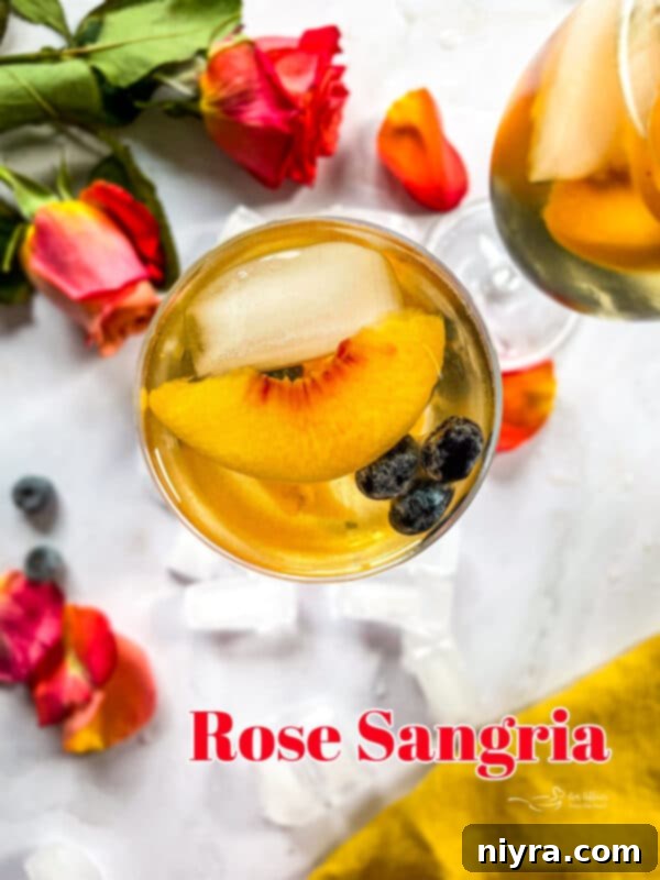 Large pitcher of Rose Sangria with fresh fruit