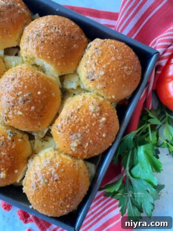 Italian Meatloaf Sliders covered with foil, ready for baking