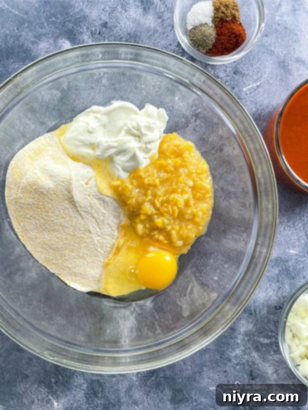 Easy Skillet Tamale Pie Video Tutorial 6 mixing bowl with Jiffy mix, egg, sour cream, and creamed corn for cornbread