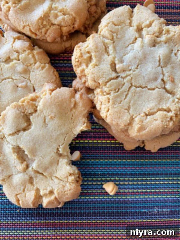 Giant Butterscotch Cookie Recipe Close-up view of several giant butterscotch cookies, showing their crinkled tops and a cascade of melted butterscotch chips.