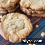 Mega Butterscotch Cookies 6 Freshly baked Giant Butterscotch Cookies on a cooling rack.