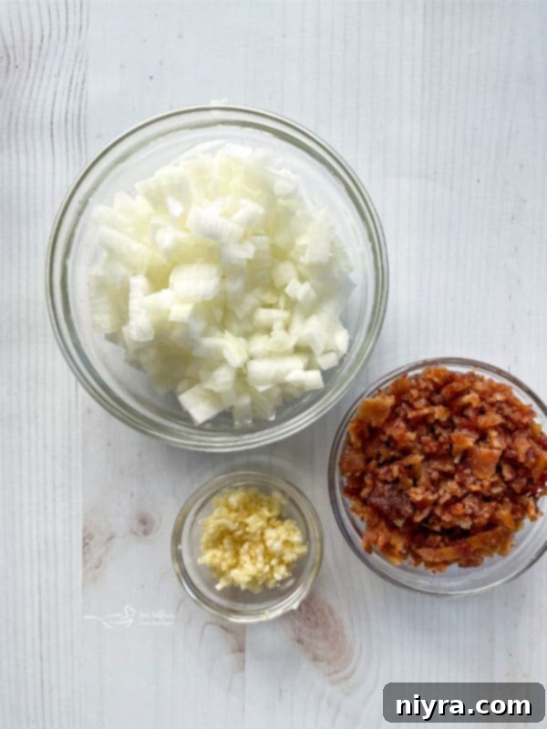 Cheesy Potatoes Au Gratin three bowls filled with onions, bacon, and garlic