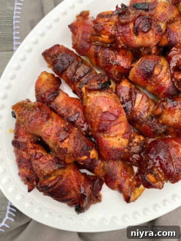 Sweet & Spicy Bacon Wrapped Chicken on a White Plate