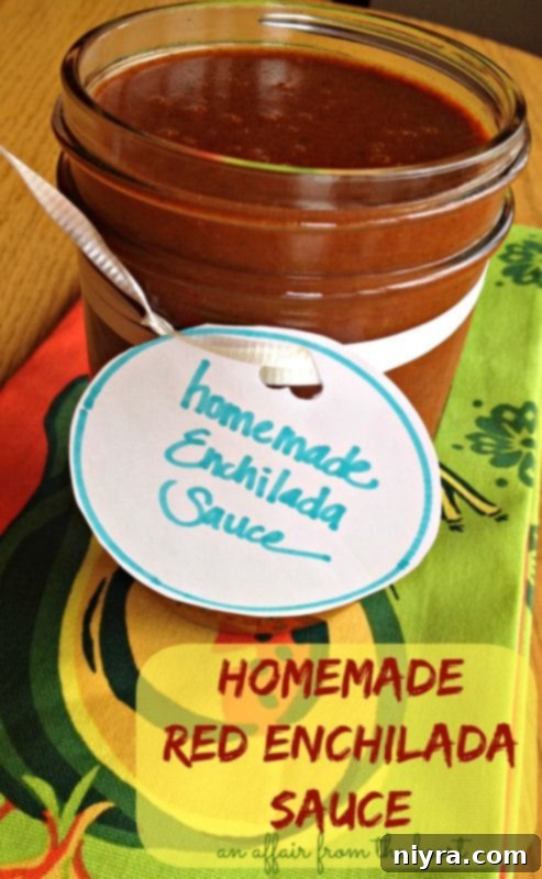 homemade red enchilada sauce in a bowl with a spoon