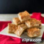 Salted Nut Roll Bars stacked on a white plate