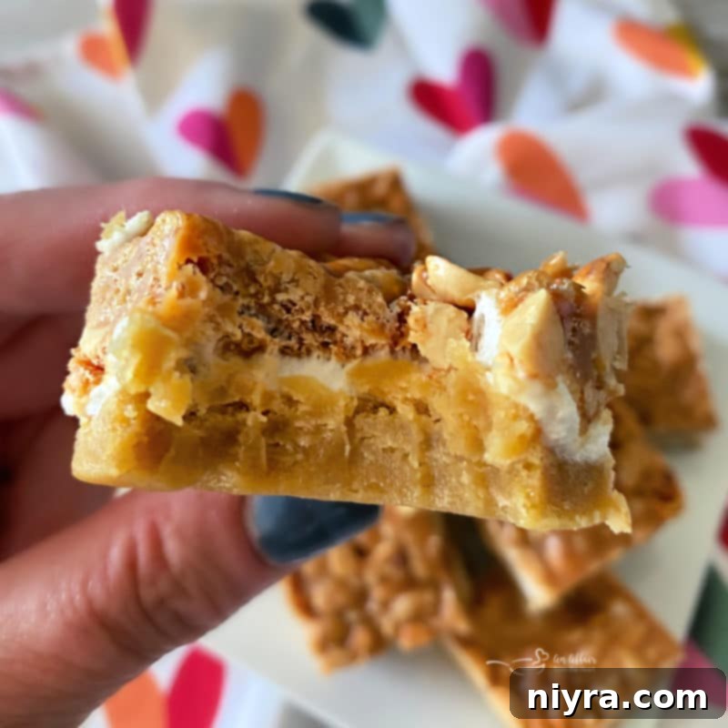 Salted Nut Roll Bars with a bite taken out