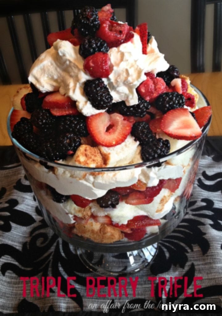 A vibrant close-up of a Triple Berry Trifle, showcasing the dessert's irresistible appeal