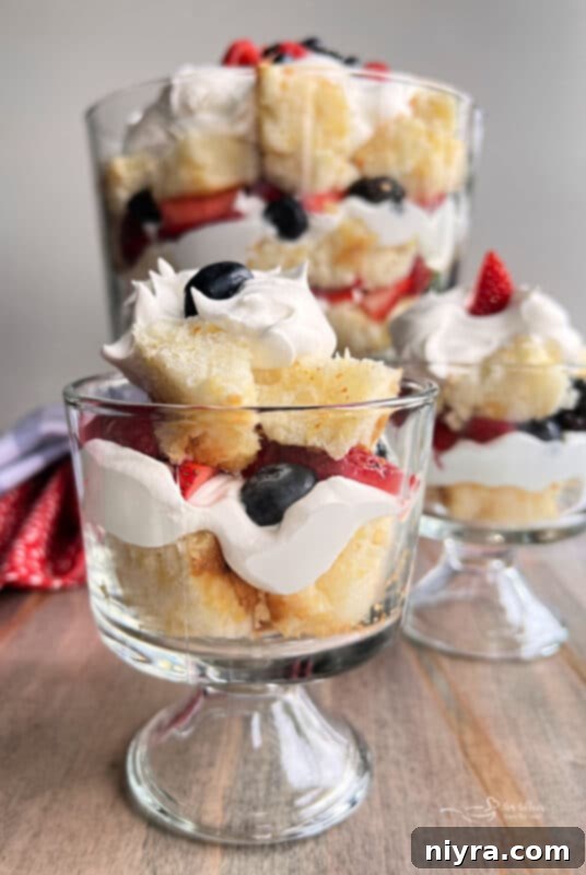 Close-up of a Berry Trifle, highlighting the vibrant layers of berries and whipped cream