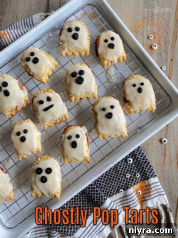 Adding the eyes and mouth to ghost pop tarts