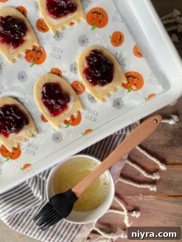 Sealing ghost poptarts with egg wash